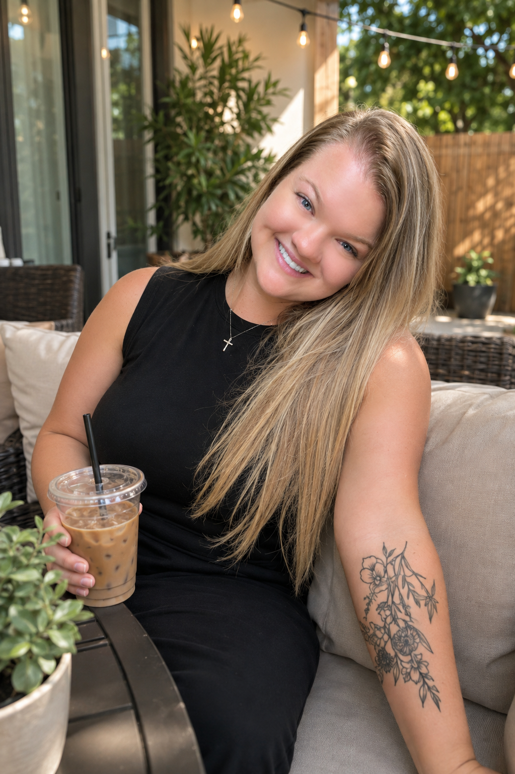 Kendyll relaxing outside with an iced coffee